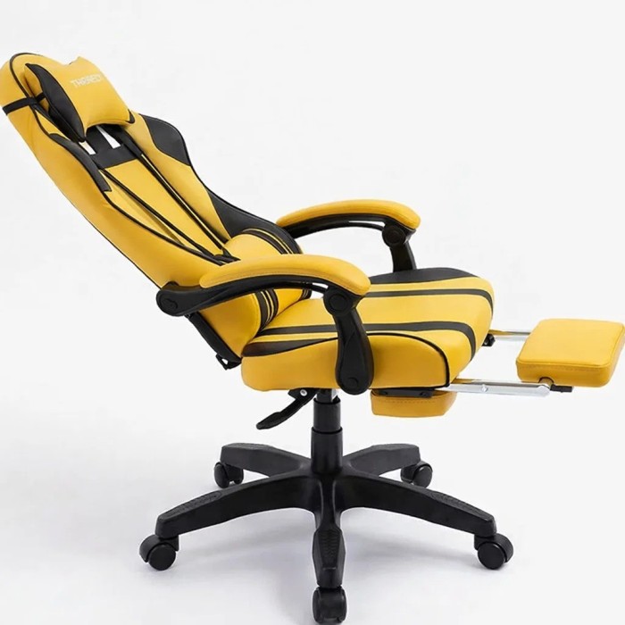 Дизайнерське геймерське крісло до 130 кг з масажною подушкою, підніжкою ThroneX жовте з чорним PVC 001